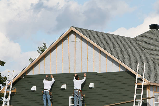 Professional Siding Installation technician working in Norwood, MA